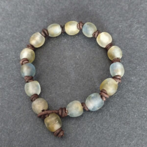 Knotted-recycled-glass-bracelet-with-African-recycled-glass-beads-golden-brown-and-soft-blue-tones