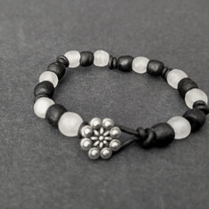 Knotted-recycled-glass-bracelet-with-black-leather-cord-button-black-and-white-button-view