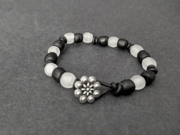 Knotted-recycled-glass-bracelet-with-black-leather-cord-button-black-and-white-button-view