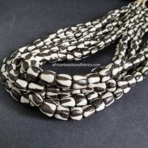 African-Beads-Kenyan-Bone-Medium-tubes-10-to-12-mm-batiked-cream-and-black-triangles