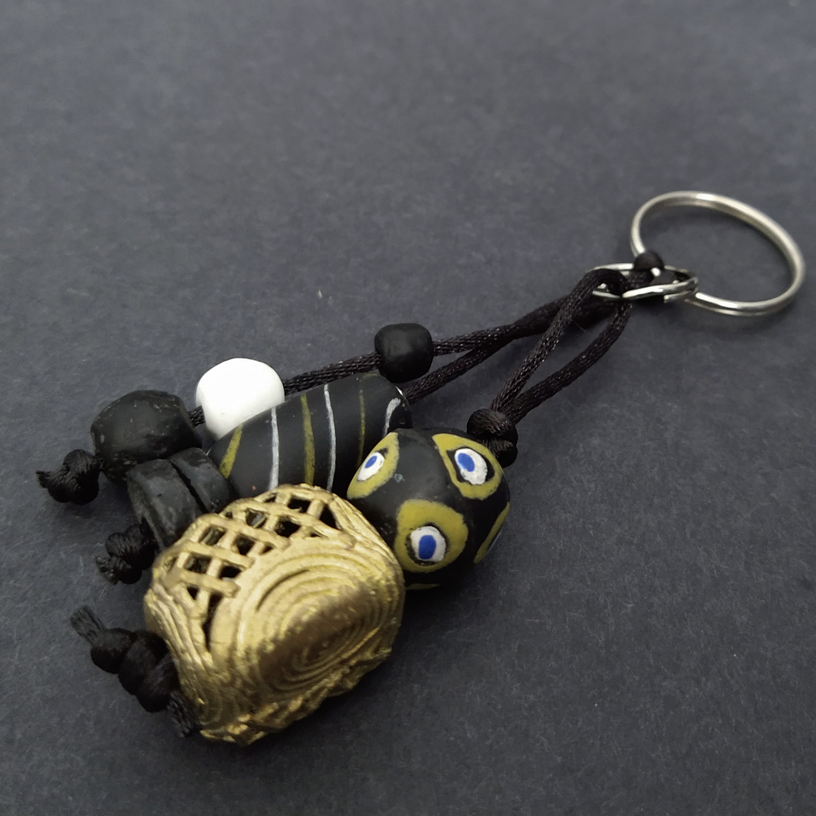 African-Bag-Charm-Ghana-Recycled-Glass-Adinkra-Beads-mask-pendant-sideview