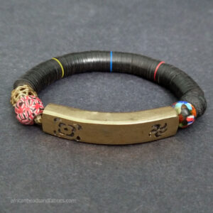 Stretchy vinyl disc and glass bead bracelet with brass bar Stretchy vinyl disc and glass bead bracelet with brass bar
